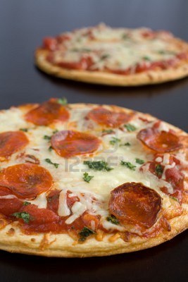 795254-pepperoni-pizza-with-mozzarella-cheese-and-parsley-fresh-out-of-the-oven.jpg